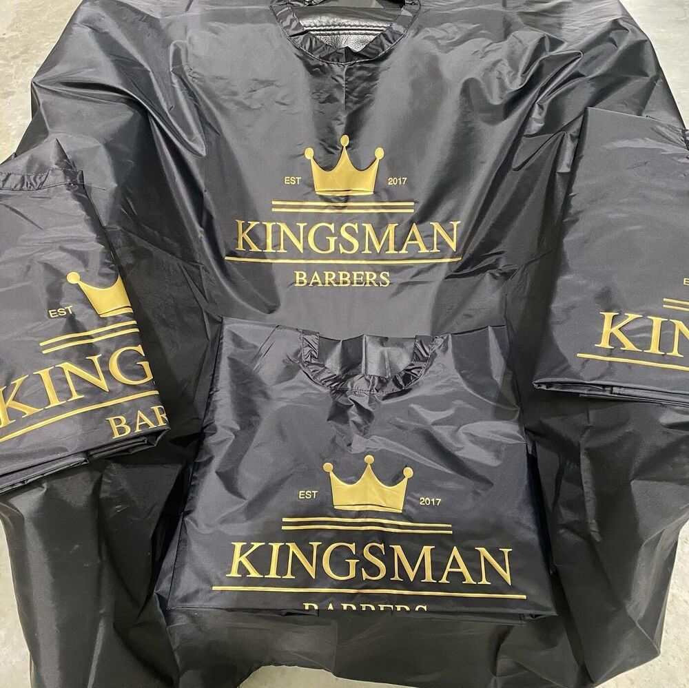 Kingsman Barbers — custom-printed barber capes